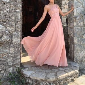 Peach one shoulder bridesmaids dress.